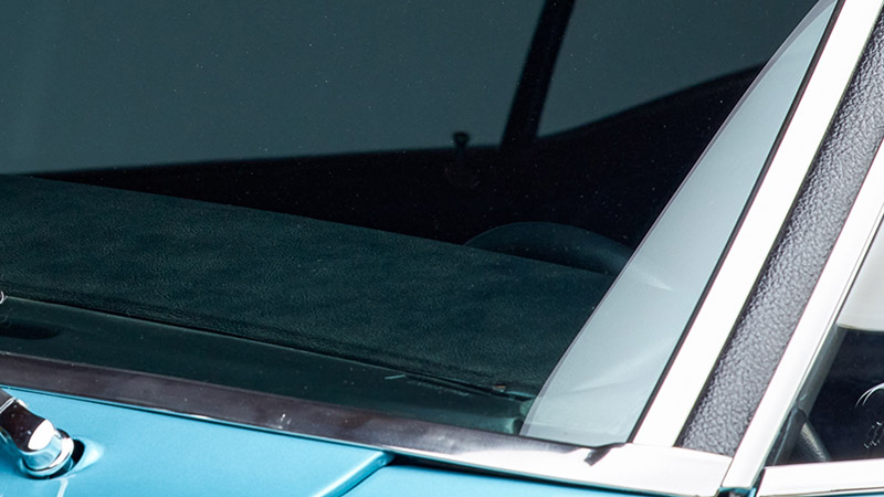 A close up of the VIN number plate through the front windshield of a 1967-1969 Chevy Camaro
