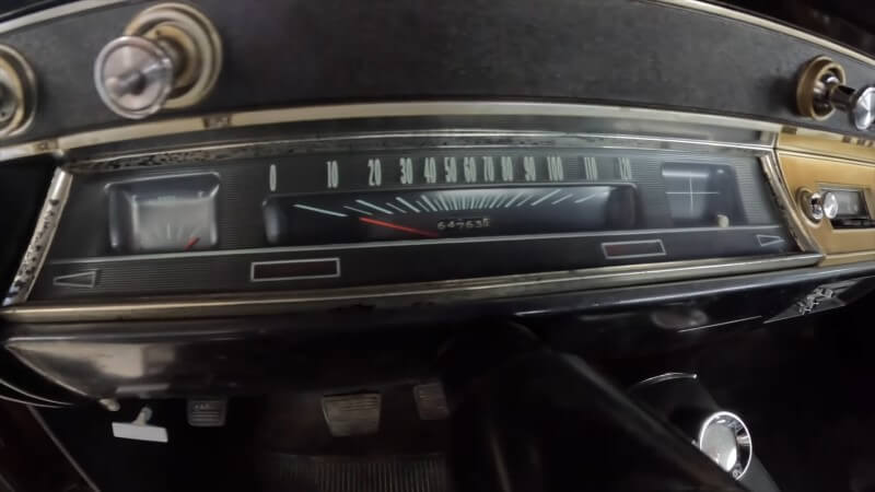 A close up of the speedometer and dashboard of a 1966 Chevelle Super Sport