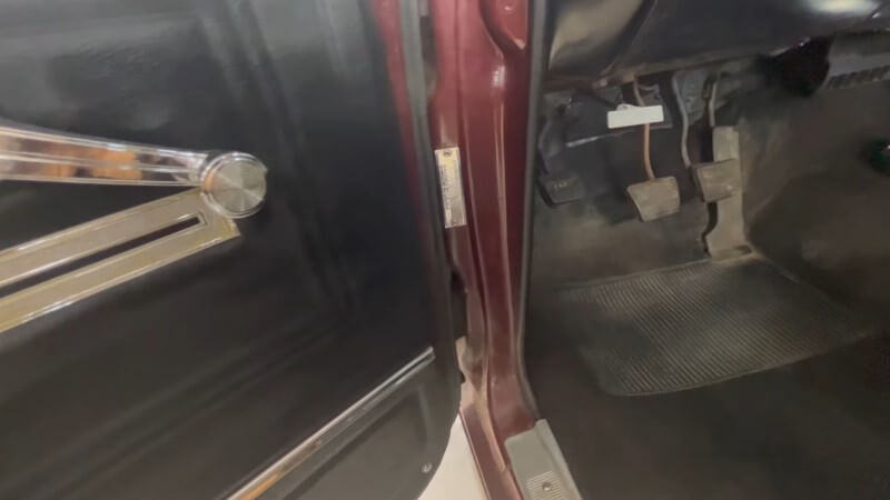 A close up of the VIN location on the A-pillar of a 1966 Chevelle Super Sport